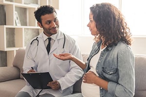 Pregnant Woman Talking to Doctor